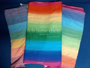Tragesortiment Regenbogen Tragetücher: Girasol Light Rainbow, Didymos Love Rainbow, Didymos Lisca Rainbow
